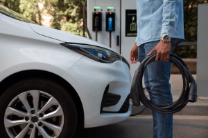 side-view-man-holding-car-cable_23-2149530053